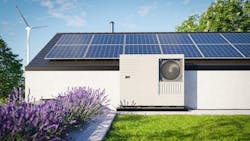A home with solar panels and a heat pump A home with solar panels and a heat pump