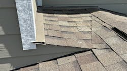 A properly formed cricket extends past the wall and directs water away from the roof-to-wall intersection A properly formed cricket extends past the wall and directs water away from the roof-to-wall intersection