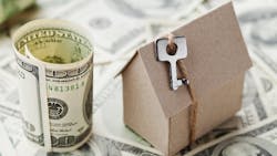 Model home sits among pile of cash Model home sits among pile of cash