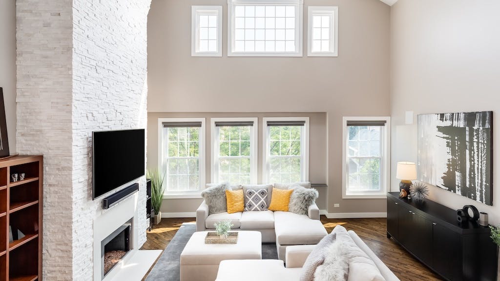 Open floor plan living room with tall ceiling