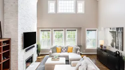 Open floor plan living room with tall ceiling
