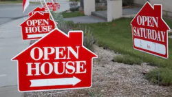 Red signs reading 'Open House' indicate a nearby home for sale Red signs reading 'Open House' indicate a nearby home for sale