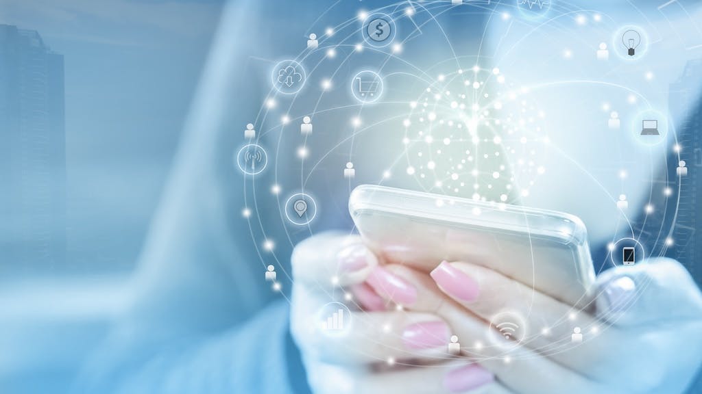 Homebuyer using their cell phone to search for housing market data