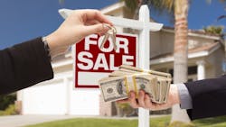 Homebuyer trades cash for house keys Homebuyer trades cash for house keys