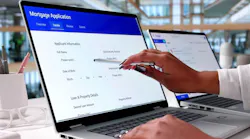 Woman fills out mortgage loan application on a laptop