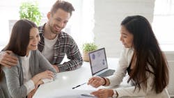 Young homebuyers speak to real estate agent Young homebuyers speak to real estate agent