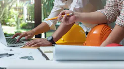 Home builders working on laptop together
