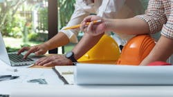 Home builders working on laptop together Home builders working on laptop together