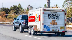 U-Haul truck driving down a highway
