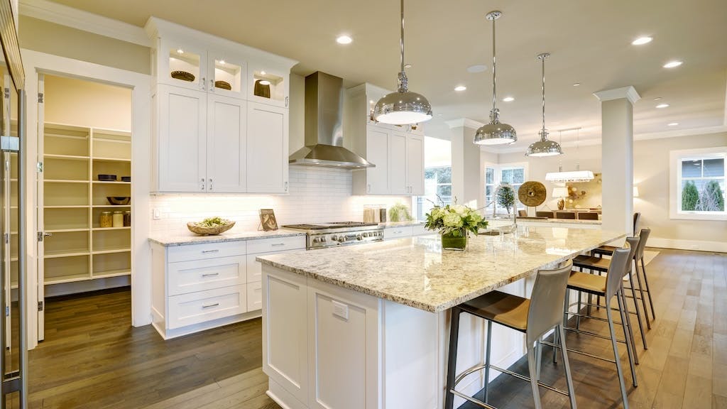 Modern white kitchen with ample storage space
