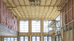A combination of closed cell and open cell insulation achieves R-21 perimeter walls and an R-49 roof system. Batt insulation on the interior walls helps control sound transmission. Photo Credit: Michael Lipman Photography