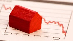 Model home sits on chart showing falling home prices Model home sits on chart showing falling home prices