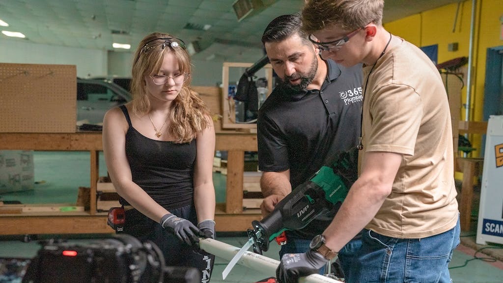 Students receiving hands-on trades experience during shop class
