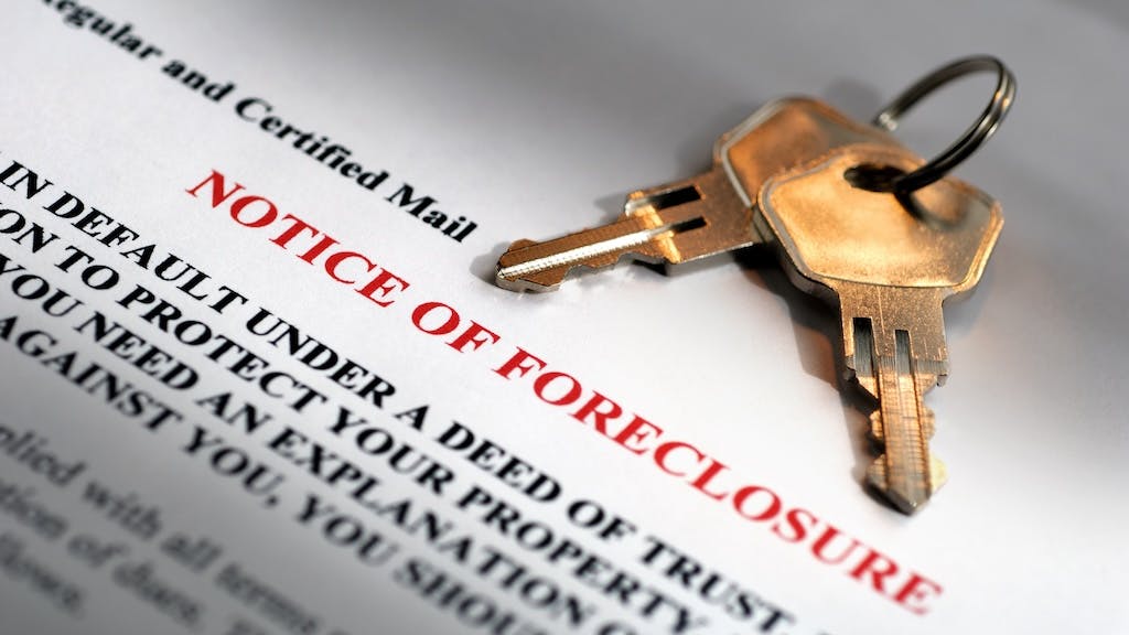 A foreclosure notice and a set of keys