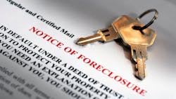 A foreclosure notice and a set of keys A foreclosure notice and a set of keys
