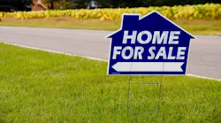 Yard sign that says 'Home For Sale'