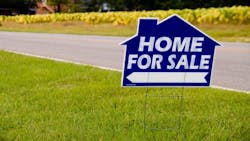 Yard sign that says 'Home For Sale' Yard sign that says 'Home For Sale'