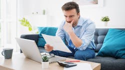 Young person working on their budget Young person working on their budget