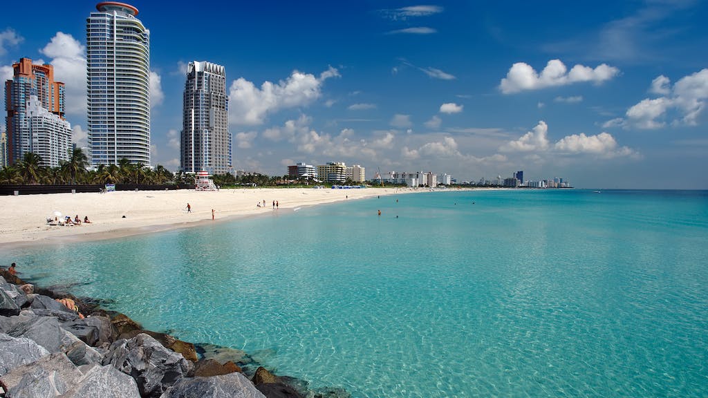 Beach in Miami with city skyline in the background