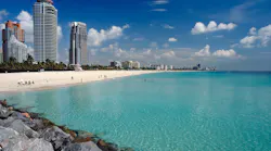 Beach in Miami with city skyline in the background