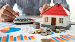 Homeowner calculating monthly expenses