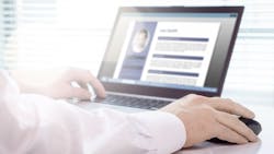 Unemployed individual making a resume on their laptop Unemployed individual making a resume on their laptop