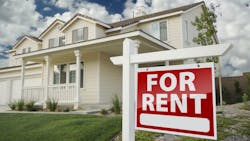 Home with a 'For Rent' sign in the front yard Home with a 'For Rent' sign in the front yard