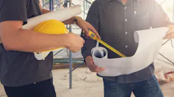 Home builders working together on a project