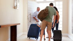 Adults with suitcases coming back to their parents' house Adults with suitcases coming back to their parents' house