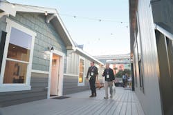 Attendees make their way toward one of the Show Village show homes Attendees make their way toward one of the Show Village show homes