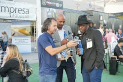 Attendees networking outside at Show Village Attendees networking outside at Show Village