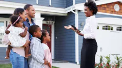 Family touring a home with a real estate agent