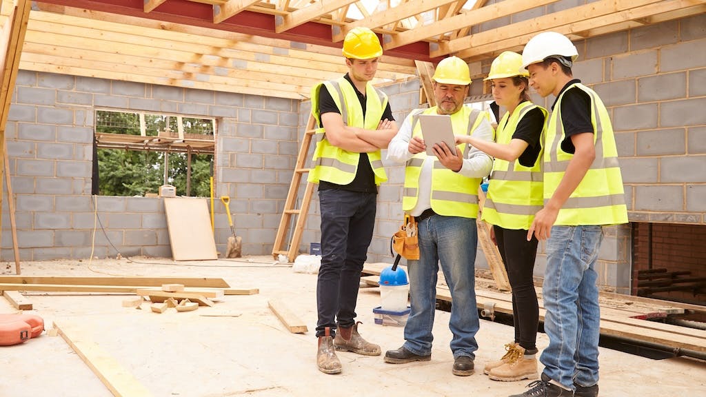 Construction workers working together on a home project