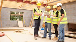 Construction workers working together on a home project