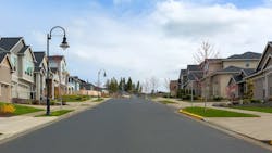 Suburban street lined with single-family homes Suburban street lined with single-family homes