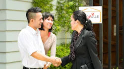 Gen Z couple touring a home with a real estate agent