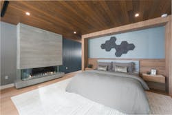 The primary bedroom offers a serene escape, with calming neutral colors, a fireplace, and a terrace overlooking the lake. The entire suite occupies an entire side of the ground level. The primary bedroom offers a serene escape, with calming neutral colors, a fireplace, and a terrace overlooking the lake. The entire suite occupies an entire side of the ground level.