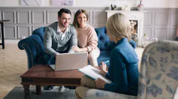 Young homebuyers meeting with a real estate agent