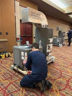 Apprentice works at station during the competition Apprentice works at station during the competition