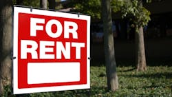 'For Rent' sign posted in a front yard 'For Rent' sign posted in a front yard