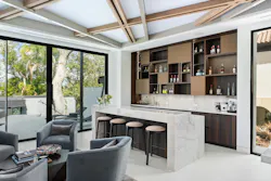 Just off the kitchen, a separate bar and lounge area provide a more intimate space in the otherwise wide-open floor plan. Just off the kitchen, a separate bar and lounge area provide a more intimate space in the otherwise wide-open floor plan.