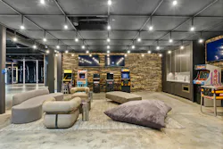 With arcade games, lounge seating, and its own kitchenette, not to mention a full spa setup across the way, the basement is far more than a garage for the owner’s car collection. With arcade games, lounge seating, and its own kitchenette, not to mention a full spa setup across the way, the basement is far more than a garage for the owner’s car collection.
