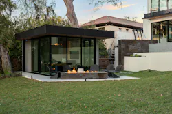 Featuring floor-to-ceiling sliding glass doors, the glass-fronted ADU serving as an office provides connection to the rest of the outdoor spaces while keeping distractions to a minimum. The fire pit is one of several placed around the pool and lanai and down toward the lake. Featuring floor-to-ceiling sliding glass doors, the glass-fronted ADU serving as an office provides connection to the rest of the outdoor spaces while keeping distractions to a minimum. The fire pit is one of several placed around the pool and lanai and down toward the lake.