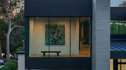 While most viewing areas orient to the lake, a private seating area within the primary suite footprint faces the front, offering a quiet space for the homeowner to enjoy privacy and select pieces of art.