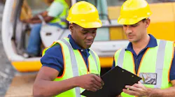 Construction workers working collaboratively