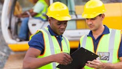 Construction workers working collaboratively Construction workers working collaboratively