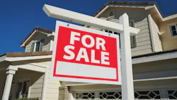 For sale sign posted in the front yard of a single-family home For sale sign posted in the front yard of a single-family home