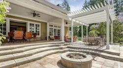 Cozy outdoor space featuring outdoor fireplace