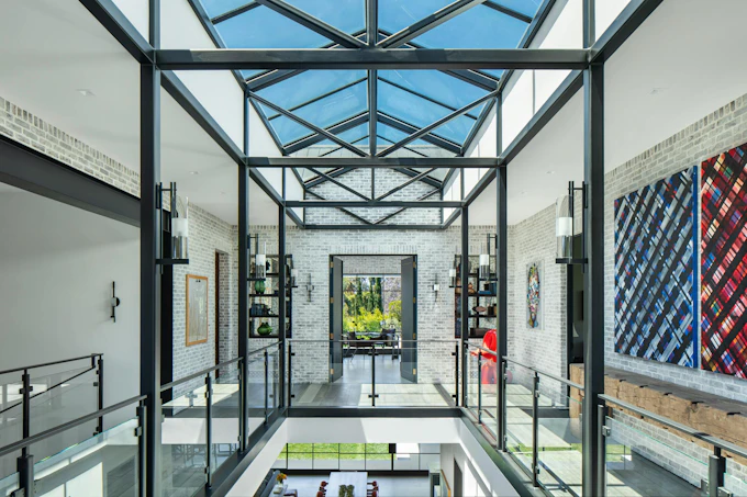 The atrium of this custom home is one of several 'memory points' featured below, all delivering a sense of wonder and unforgettable moments.