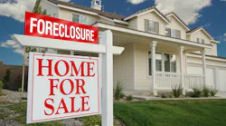 Foreclosure sign in front of a home